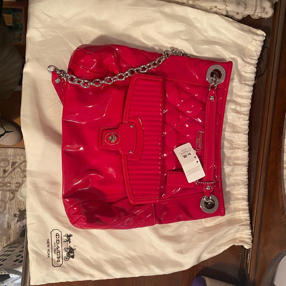 Coach pop red adjustable strap hand bag.